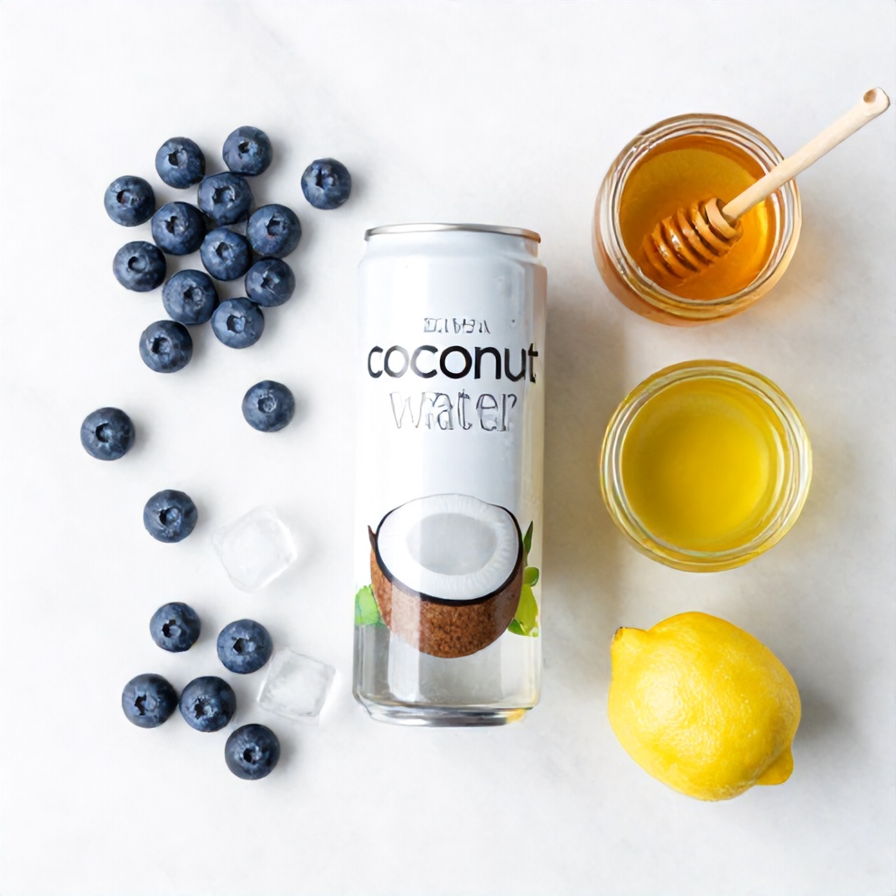 Blueberries, coconut water, lemon juice, honey, and ice on a wooden surface