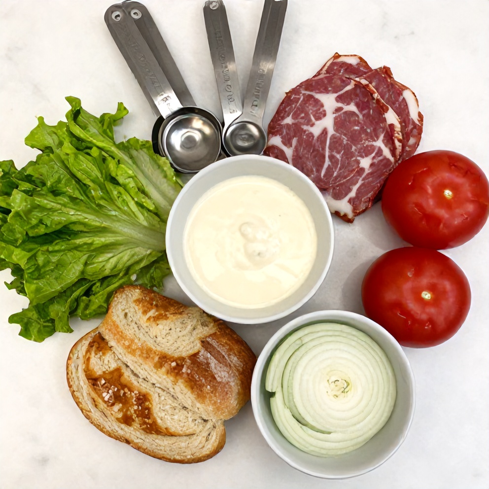 Italian Grinder Salad Sandwich ingredients on a marble counter