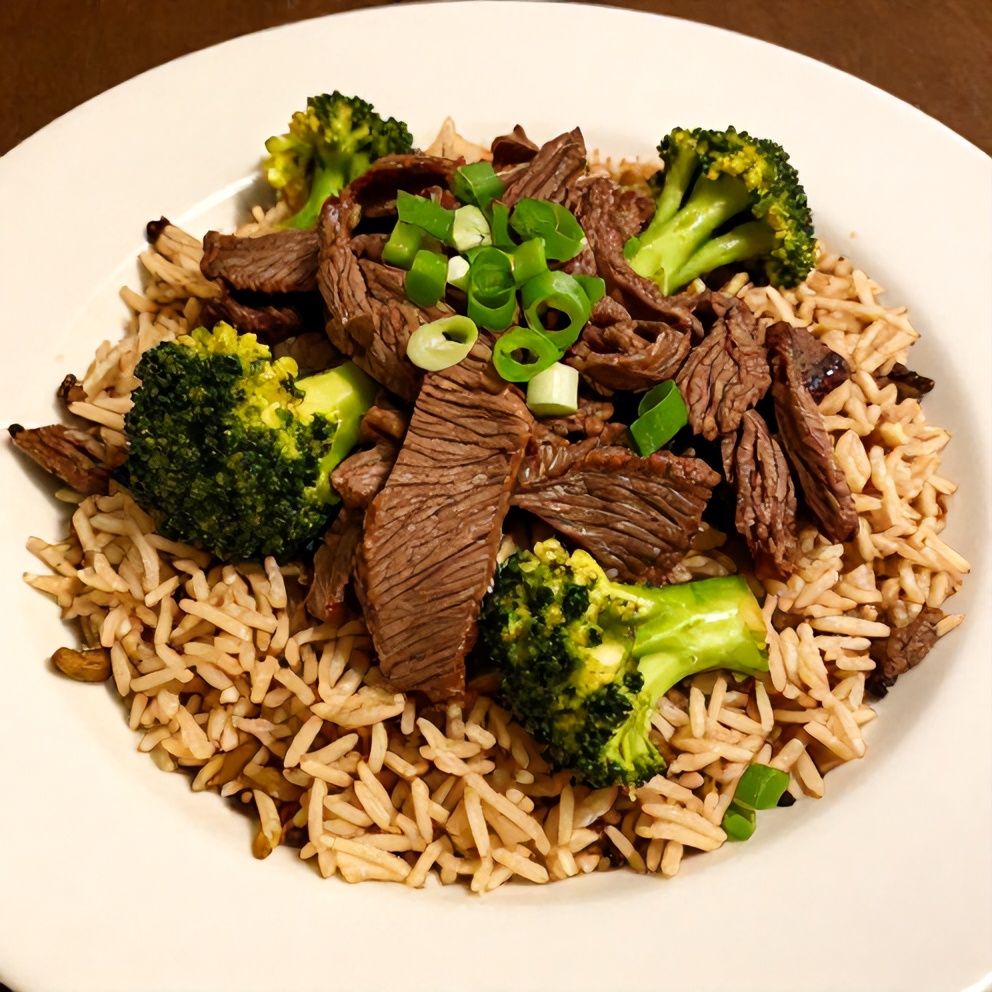 Beef and Broccoli Rice Bowls plated with a garnish of green onions