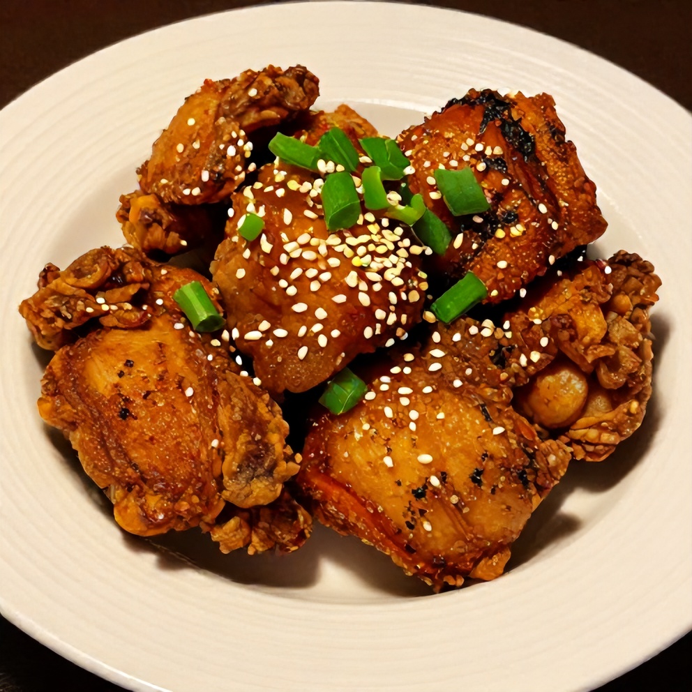 Plated Crispy Honey Garlic Chicken on a white plate